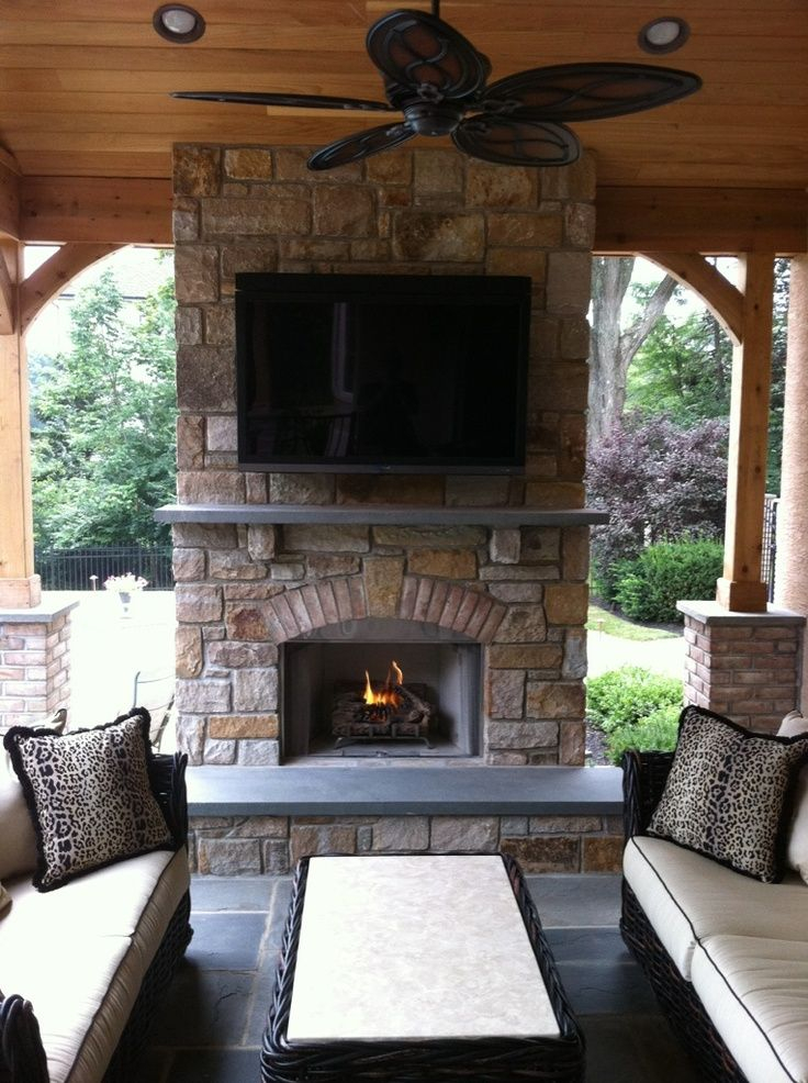 I Like The Stone The Wide Hearth And The TV Above Outdoor Fireplace